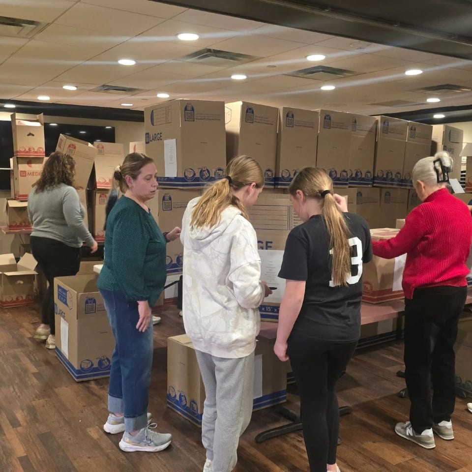 Volunteers organizing boxes